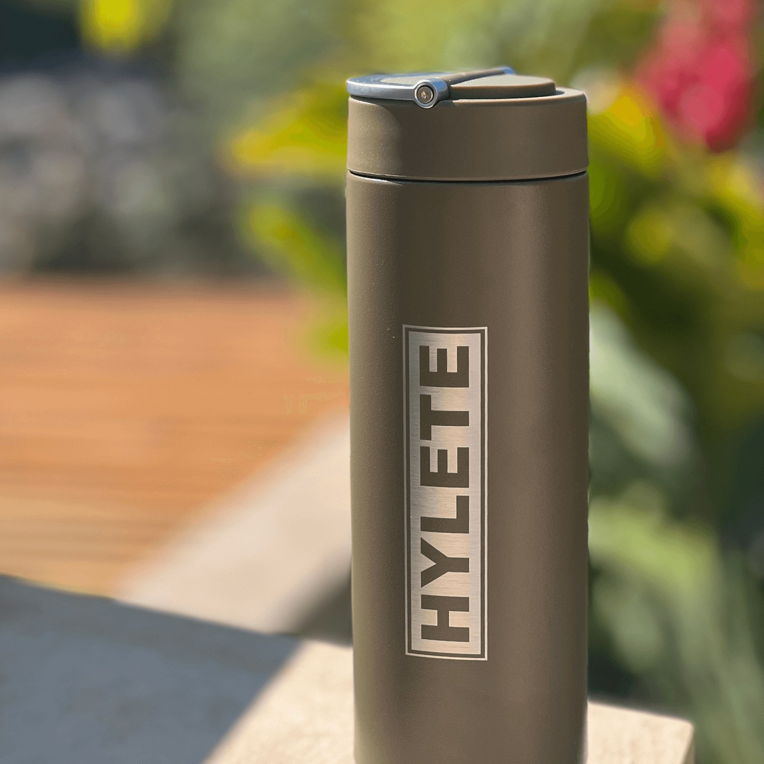 HYLETE x Mizu insulated water bottle in olive green, featuring double-wall insulation and sleek design.