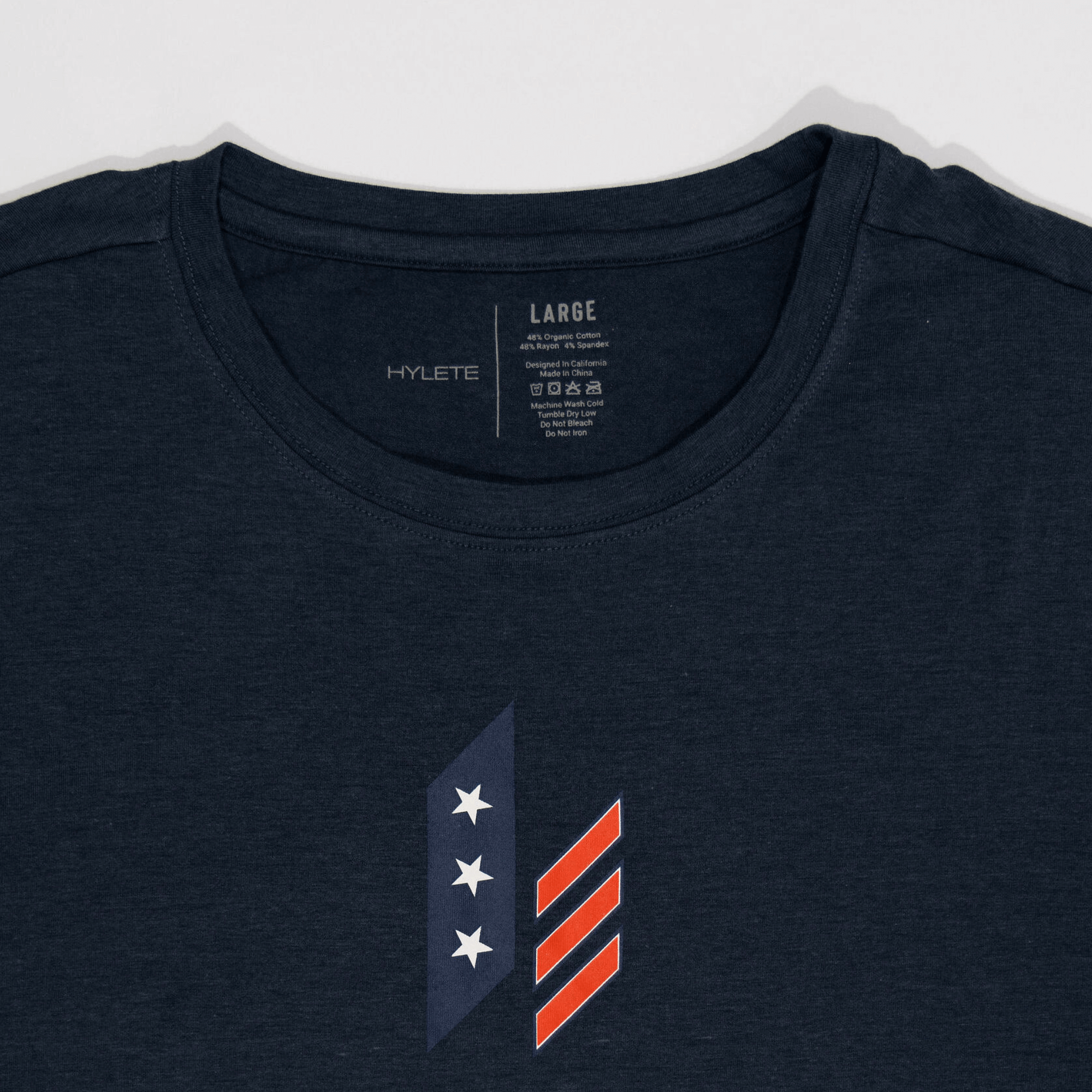 "Stacked Nation HY-Blend Crew Tee Navy with logo design, combining performance and recovery for versatile athletes."