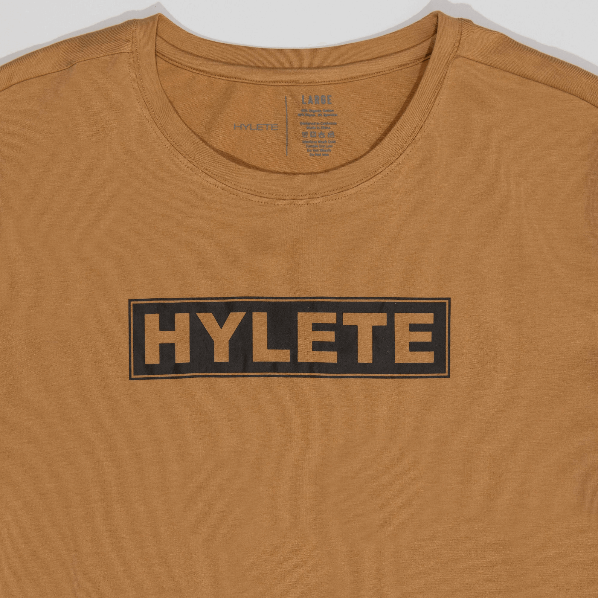 Tan Block Logo HY-Blend Crew Tee featuring high-performance and recovery design with buttery smooth, stretchy fabric.