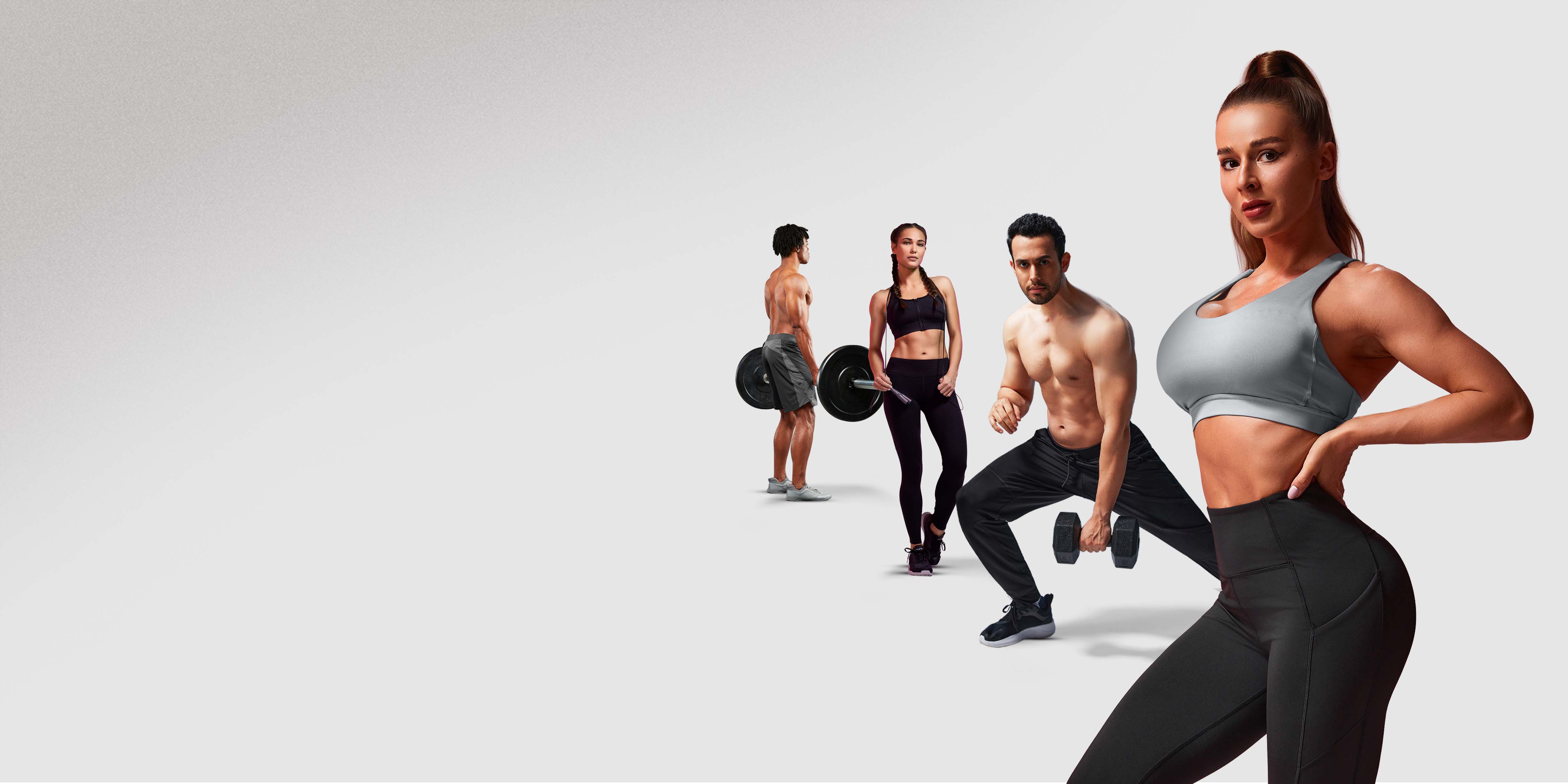 A promotional image featuring four fit people in Hylete gear (two men and two women) posing with gym equipment, including dumbbells and barbells, against a plain light background. A woman in a gray sports bra is prominently featured in the foreground.
