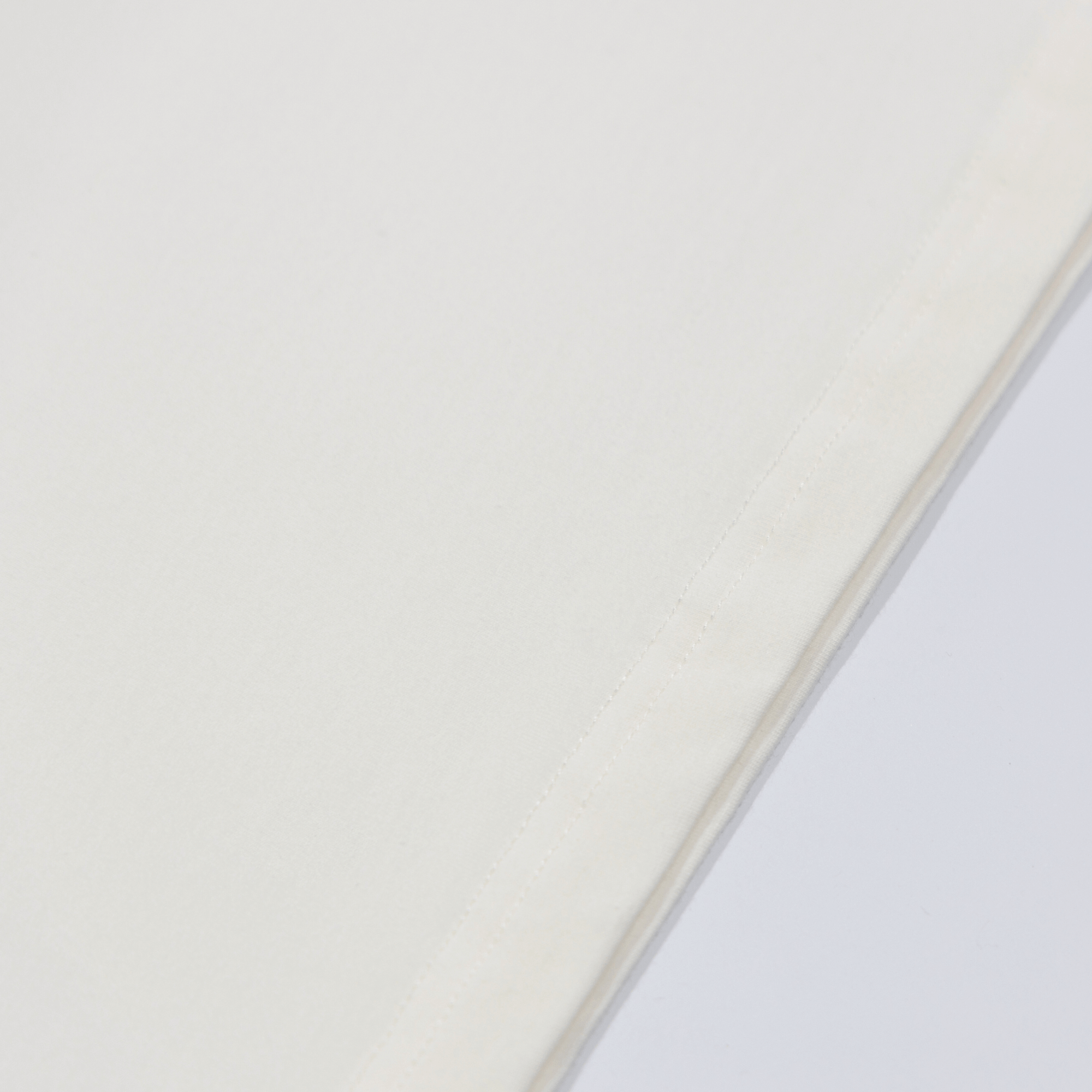 Close-up of white Camo Icon HY-Blend Crew Tee fabric showcasing its smooth texture and premium craftsmanship.