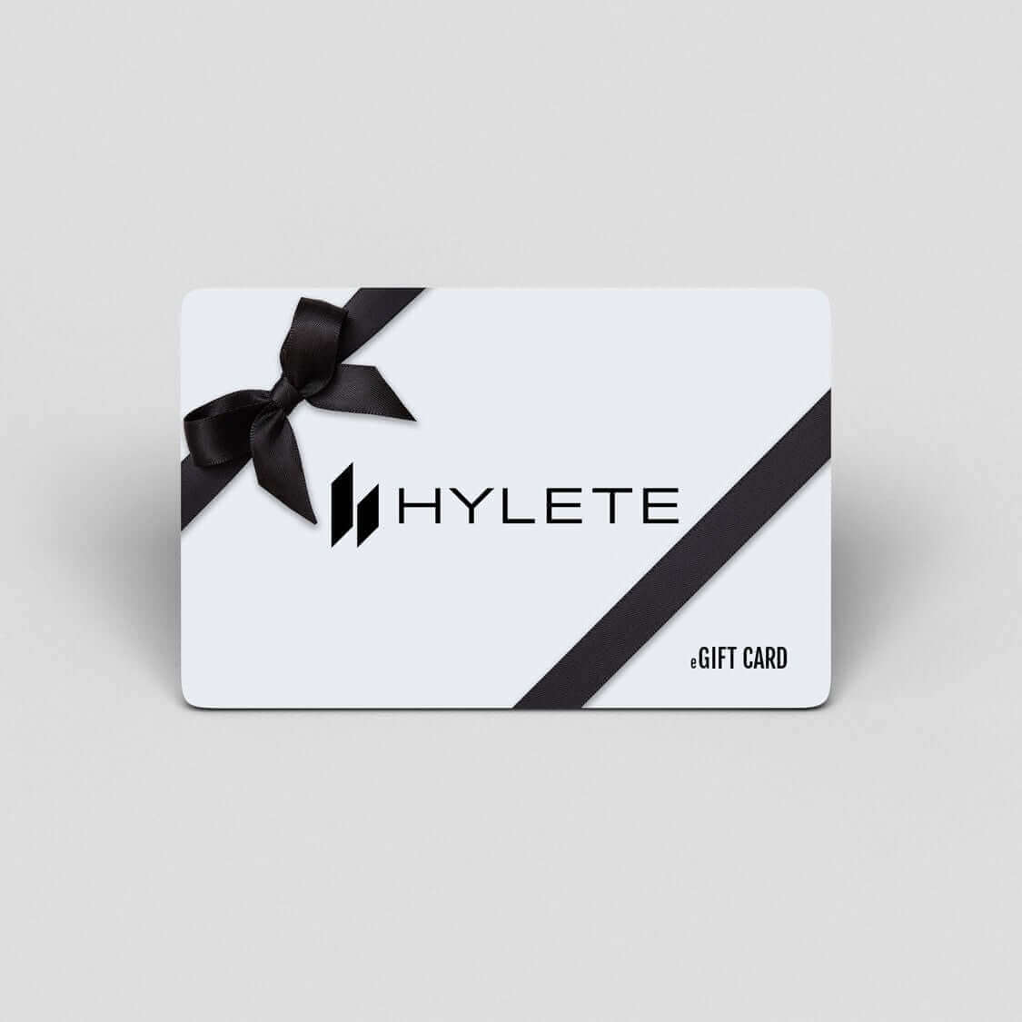 HYLETE gift card with black ribbon, offering flexible shopping choices. Perfect gift solution with e-delivery and no extra fees.