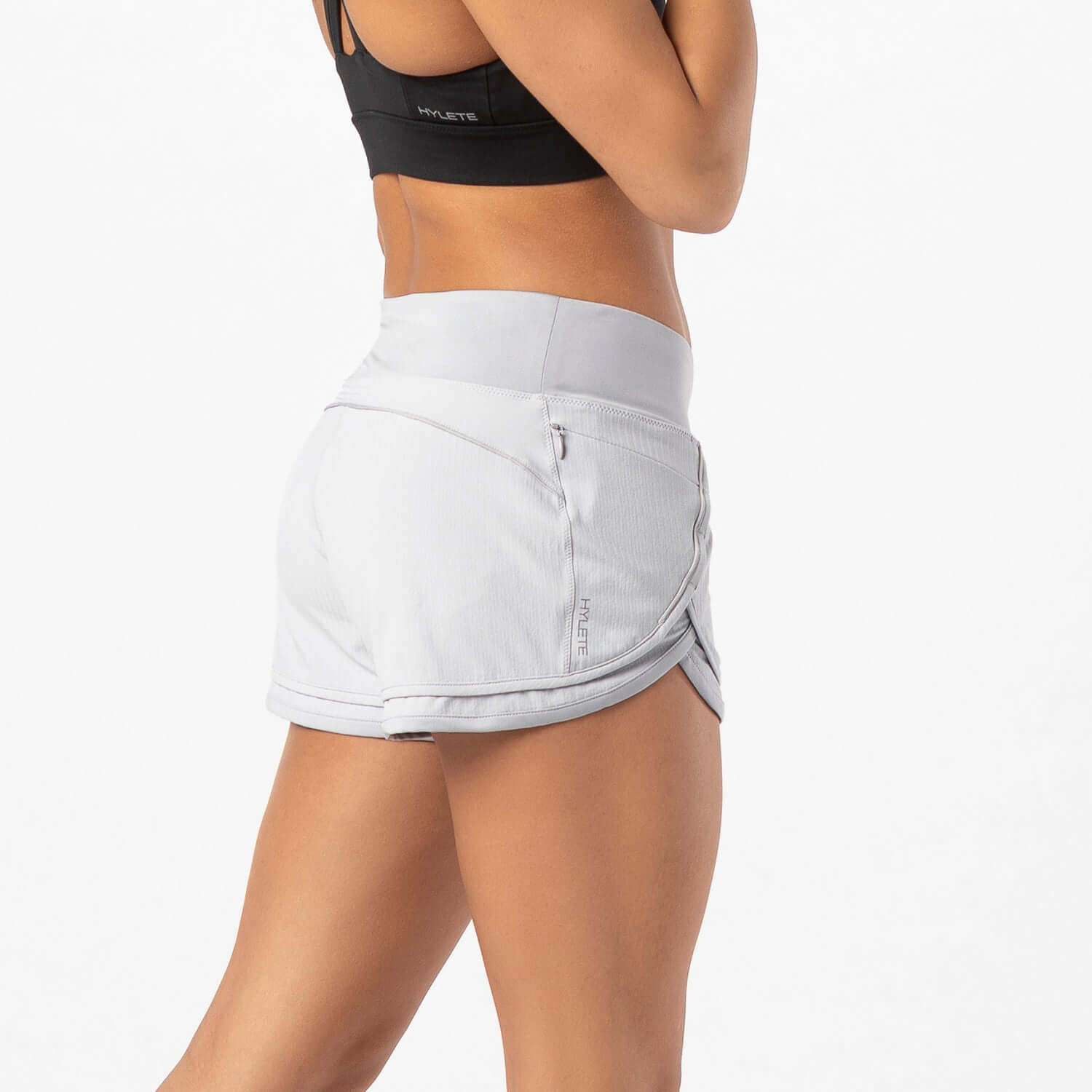Woman wearing Iris Lined Short Silver, showcasing its Flex-Knit waistband and comfortable fit for workouts.