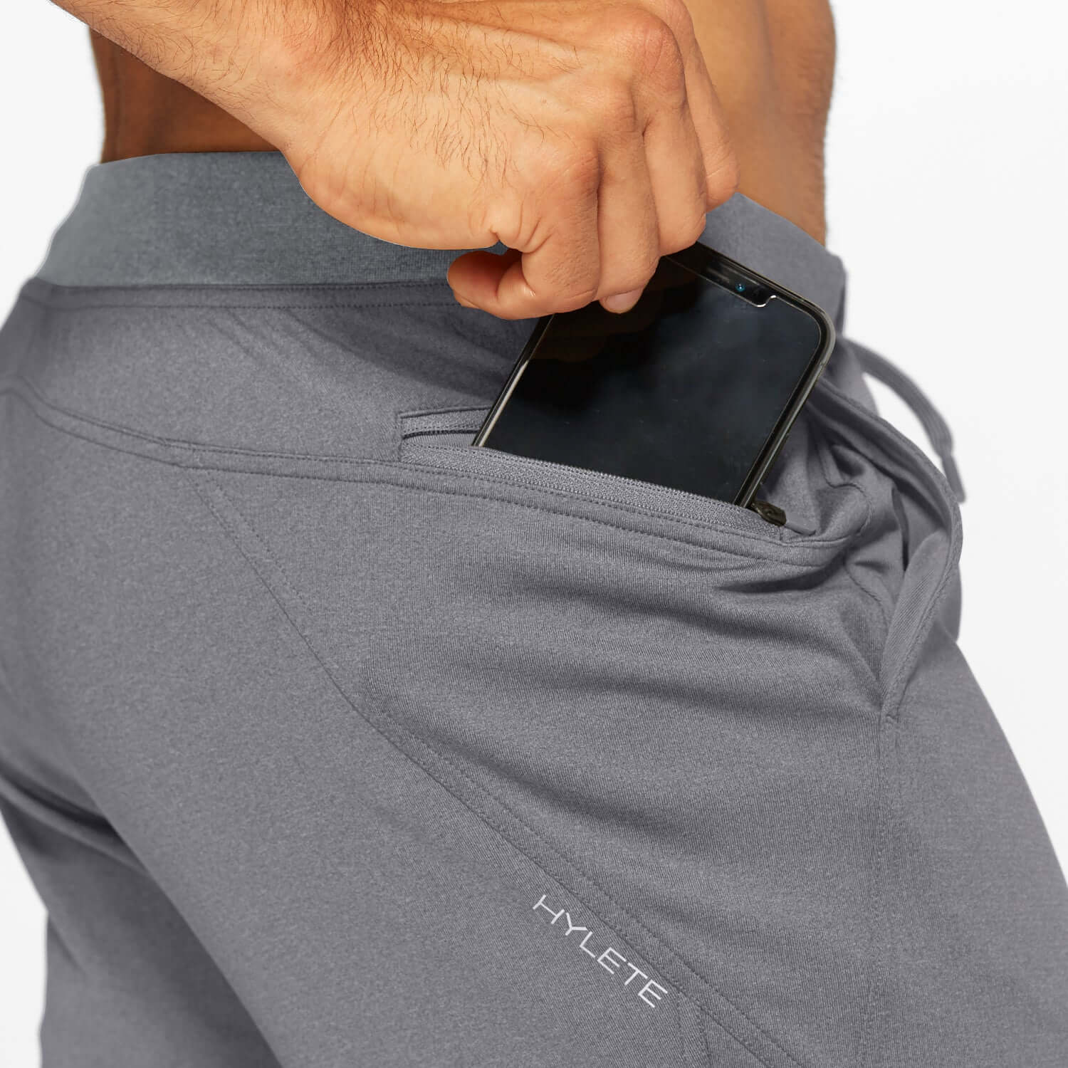 Flexion II Jogger in heather slate gray with phone in pocket, showcasing comfort and practicality for active lifestyles.