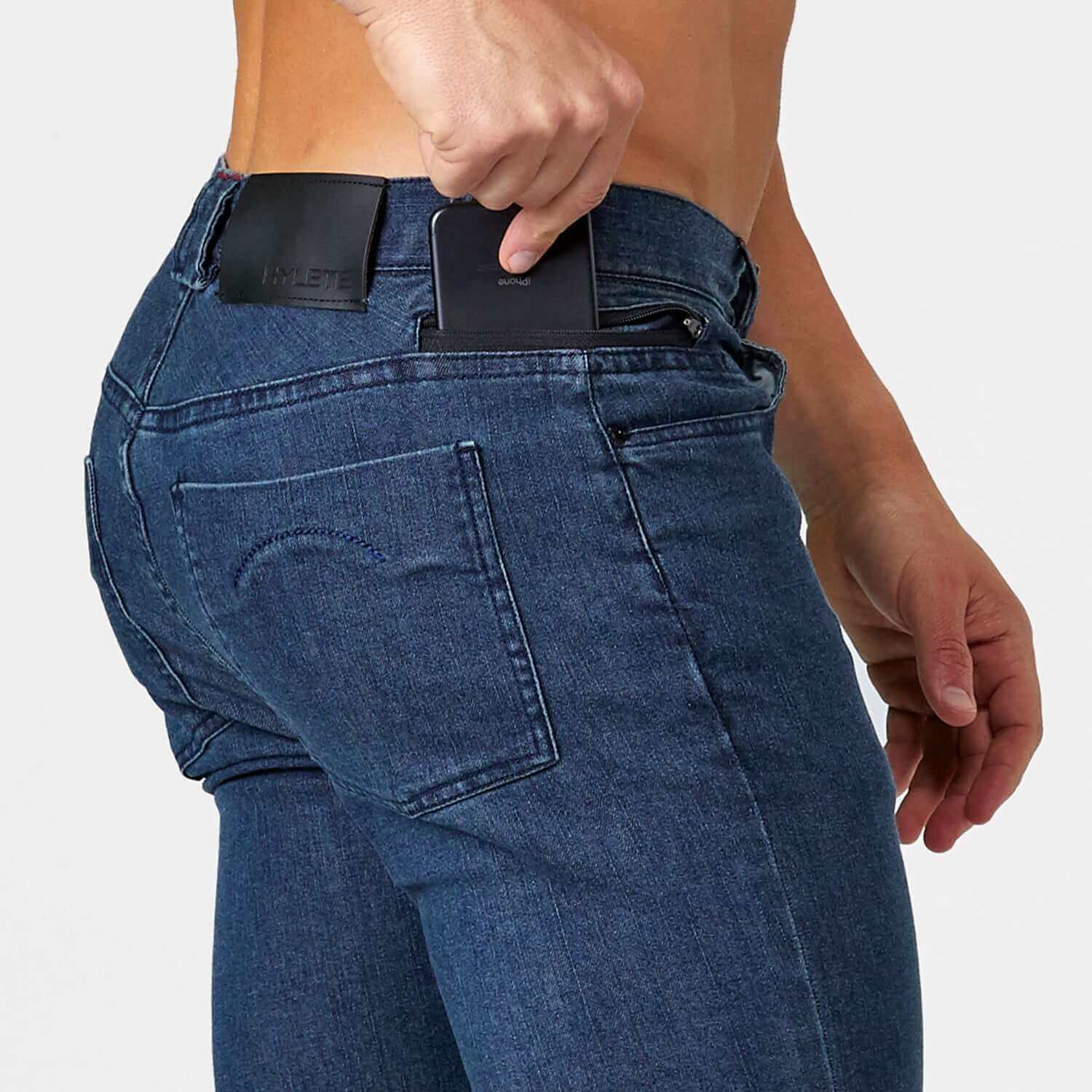 Model wearing Optic II Denim Indigo Stealth Black jeans, showcasing 5-pocket design and effortless style.