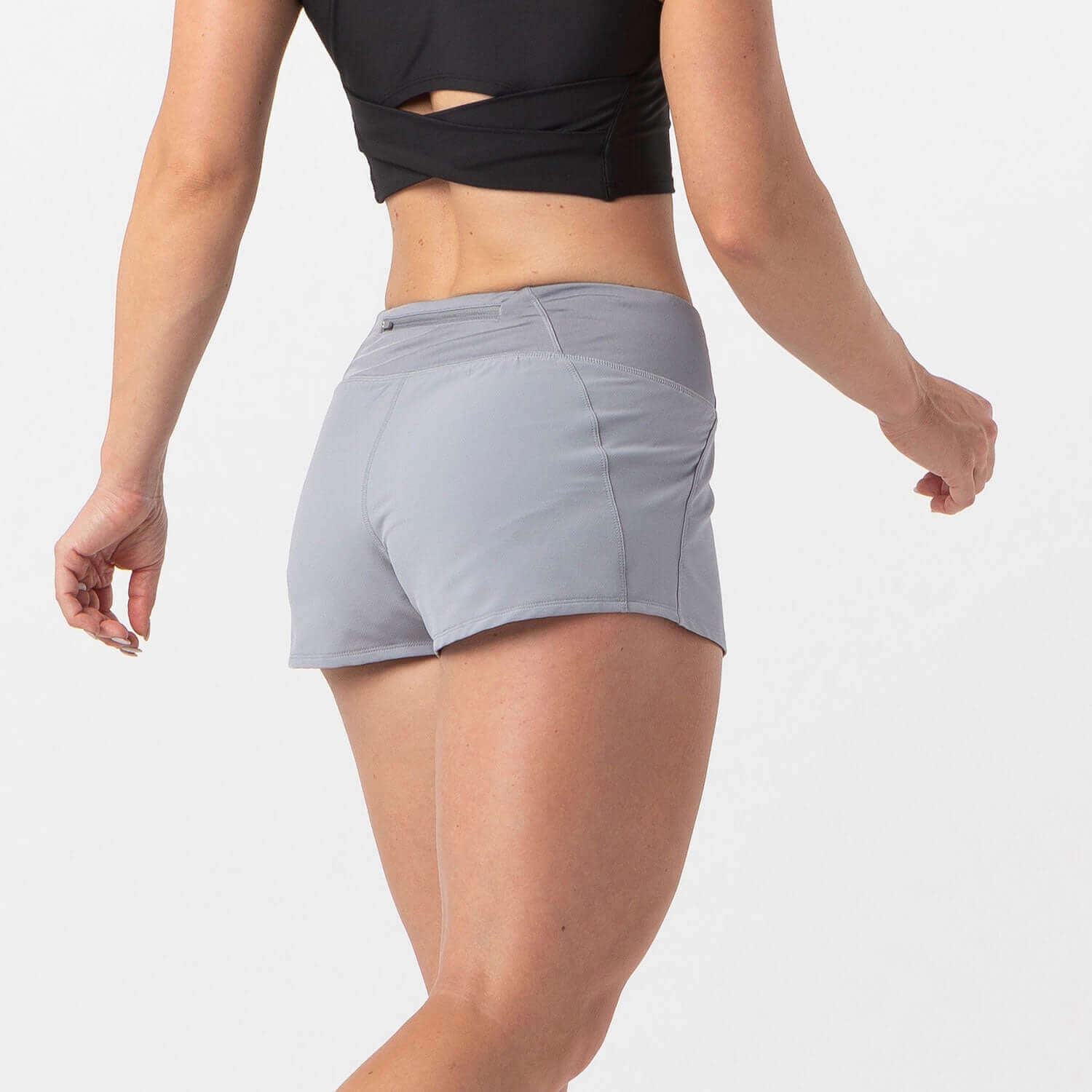 Woman wearing Vita Short Eclipse Gray for runners and HIIT workouts, highlighting lightweight fabric and smooth waistband.