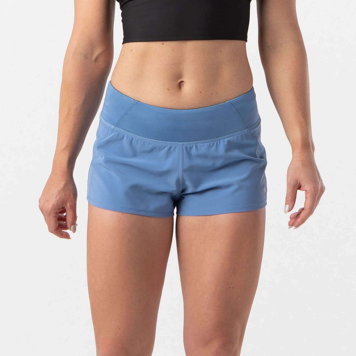 Dusty blue running shorts for HIIT and running with smooth waistband and zip pocket, designed for comfort and performance.