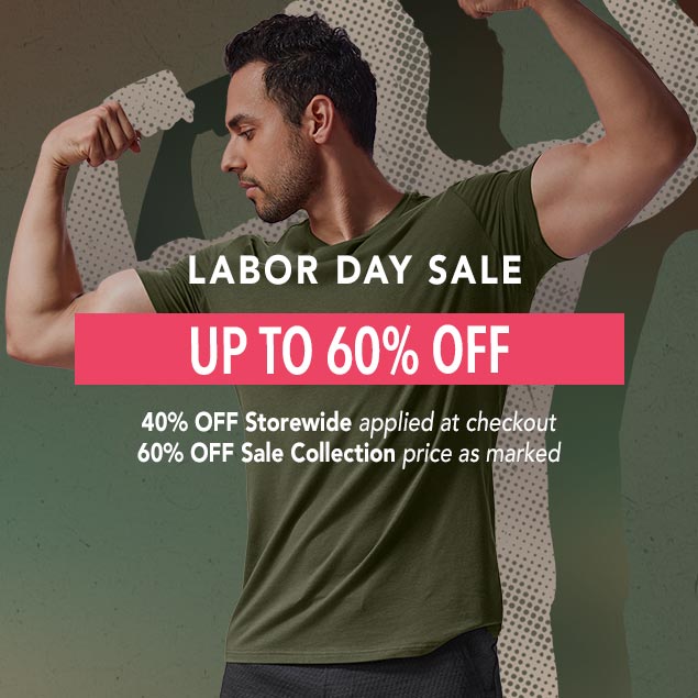 A man wearing minimalist HY-Blend crew tee olive green and Recline short black flexing his biceps. Text on the image says 