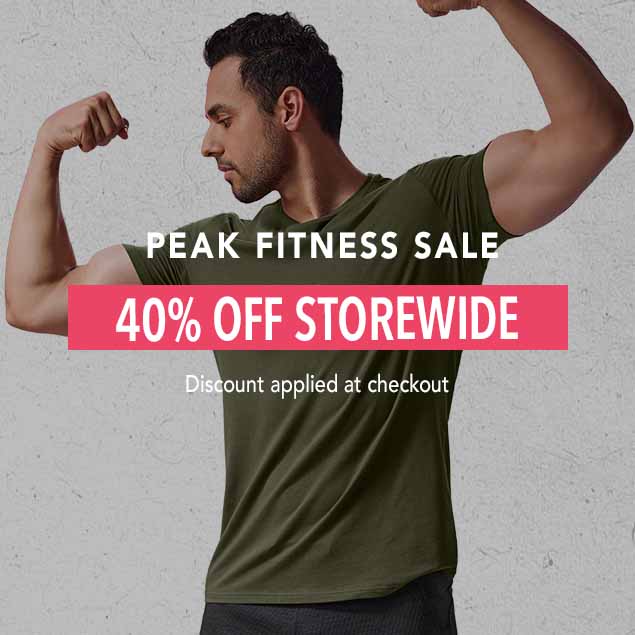 A muscular man in a green t-shirt flexes his arms. The image is overlaid with the words 