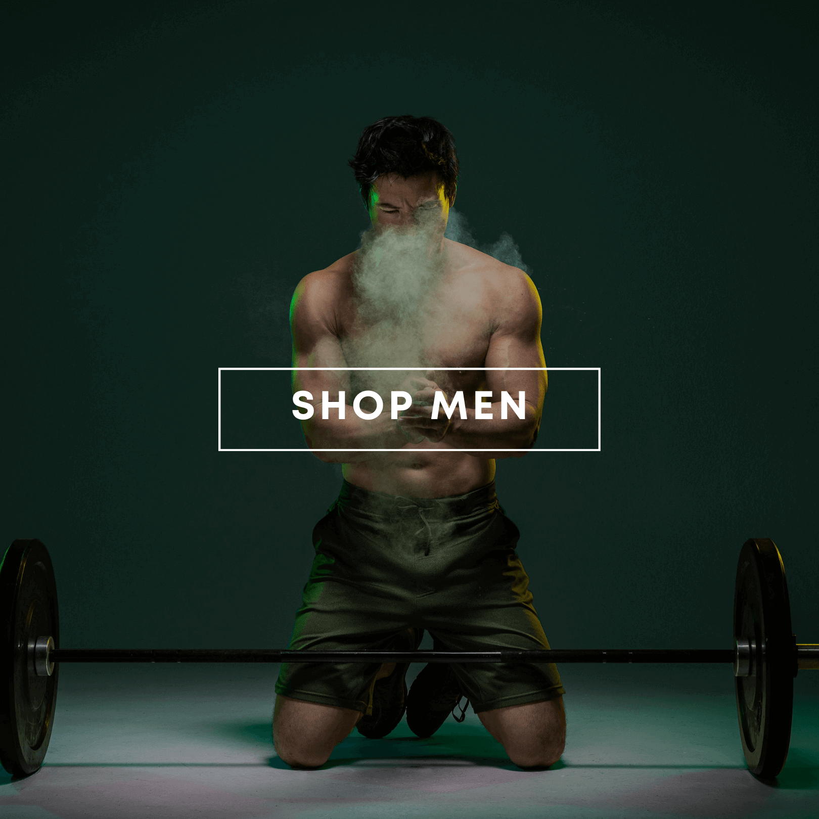 A muscular man kneels to clap chalked hands over a barbell, wearing dark green HYLETE training shorts, with text "SHOP MEN" overlaid.