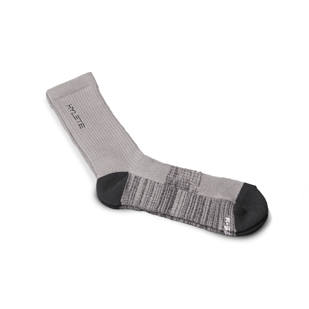Cool Gray and black midweight crew socks by HYLETE, designed for performance and comfort.