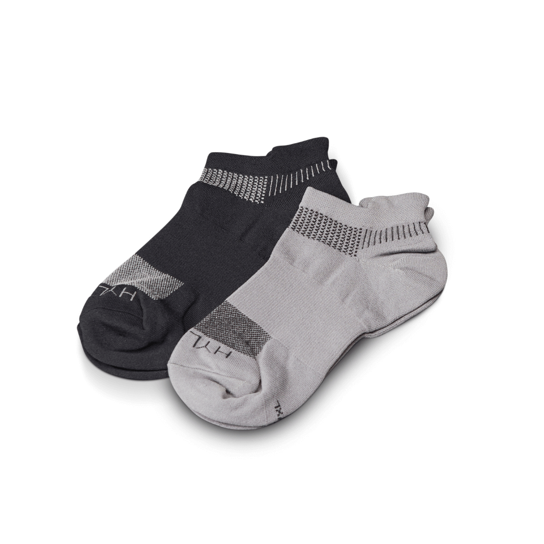 Lightweight run socks in cool gray and black, offering breathability and support for running performance.