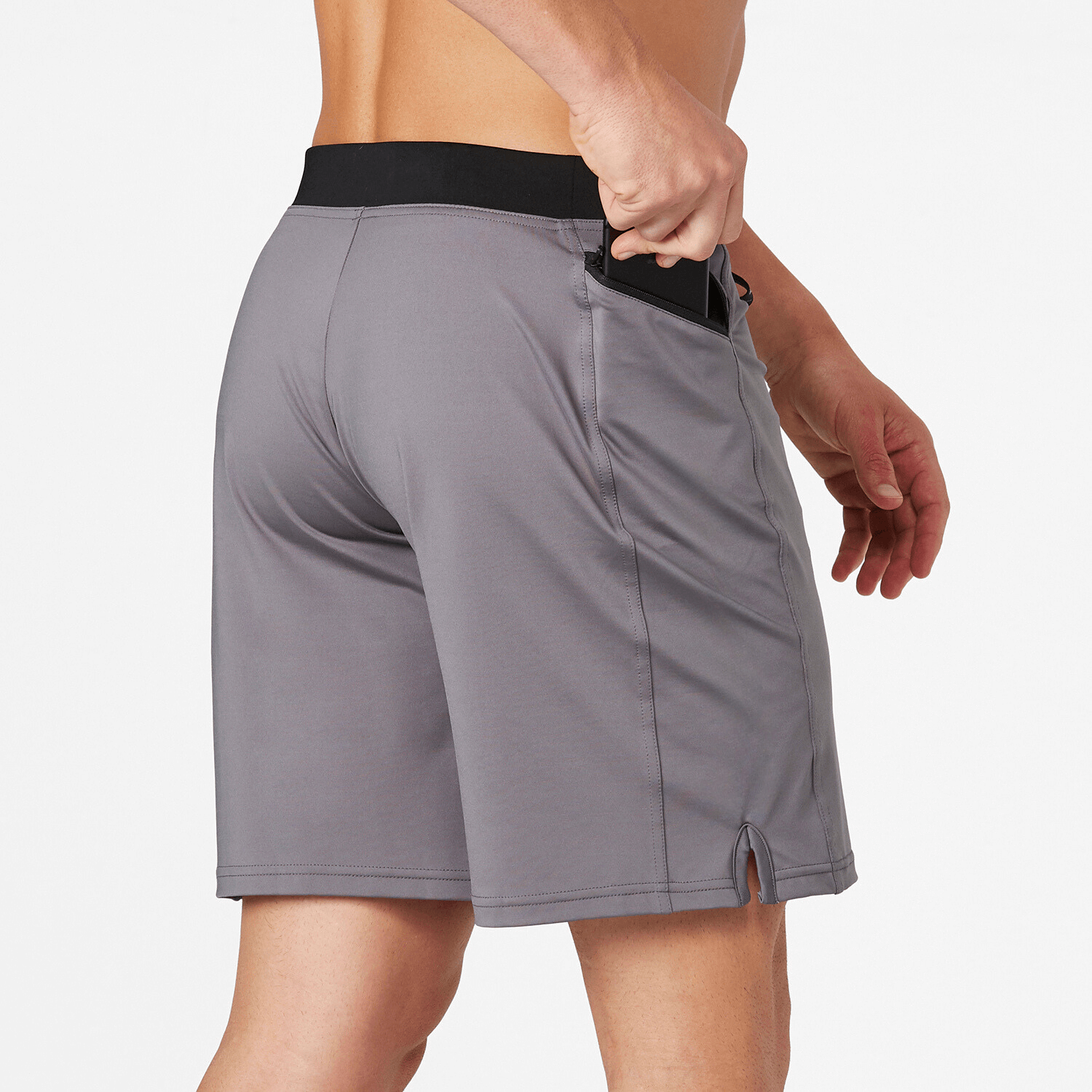 Man wearing Vertex II Short in Cool Gray, showcasing flexible fabric and side pocket for workouts and outdoor activities.